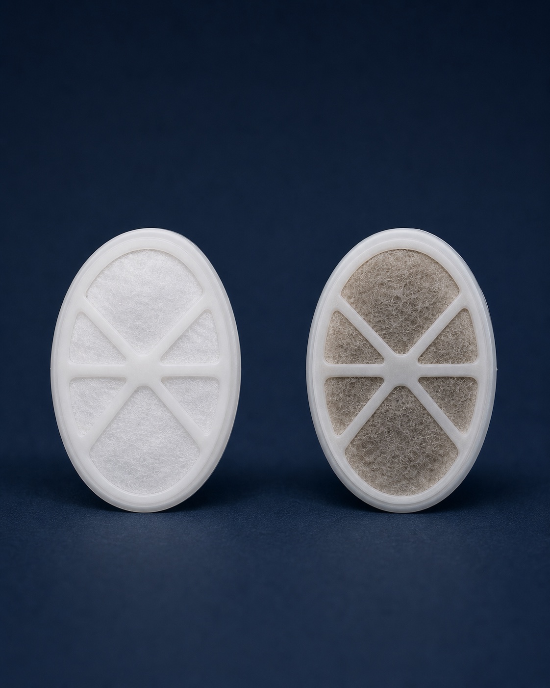 Side-by-side comparison of a clean white filter and a visibly darkened used filter